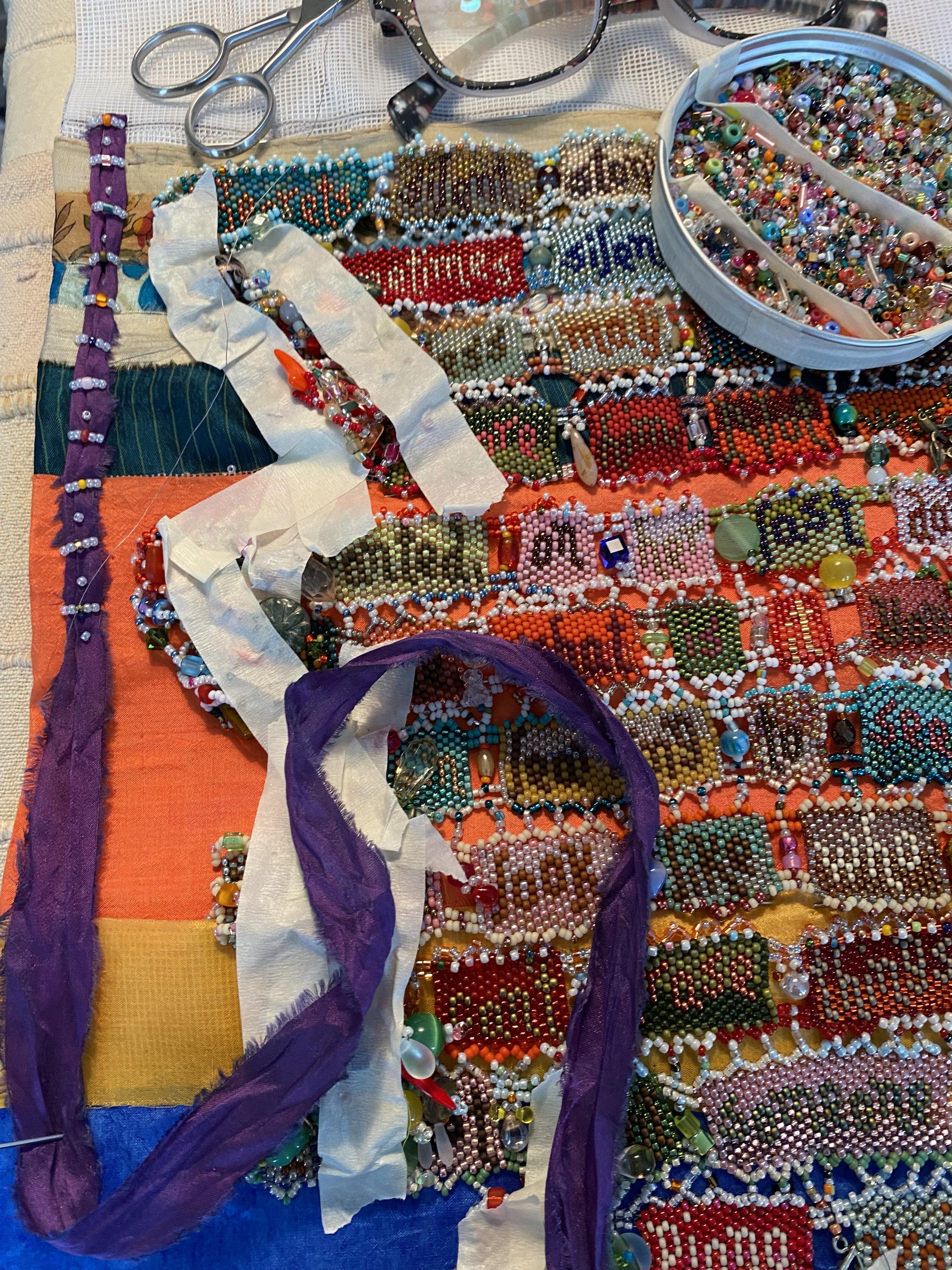 Preparing left edge for sari silk fringe.