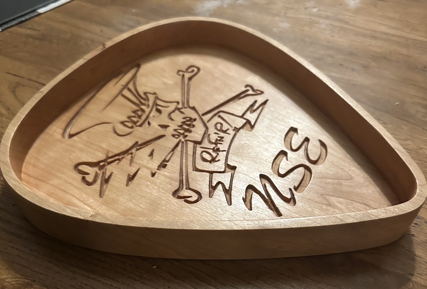 Wooden tray with engraved compass rose and the words 'Sea, Sun, Surf, Salt, Sand, Surf'.