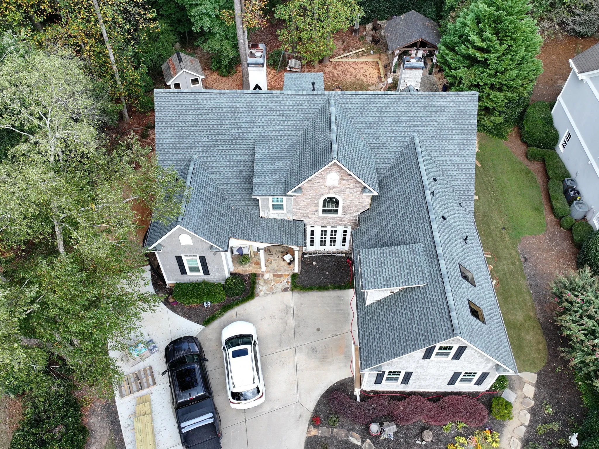 Complete residential roof installation by 1 Source Industries for a modern home in Taylorsville, GA.