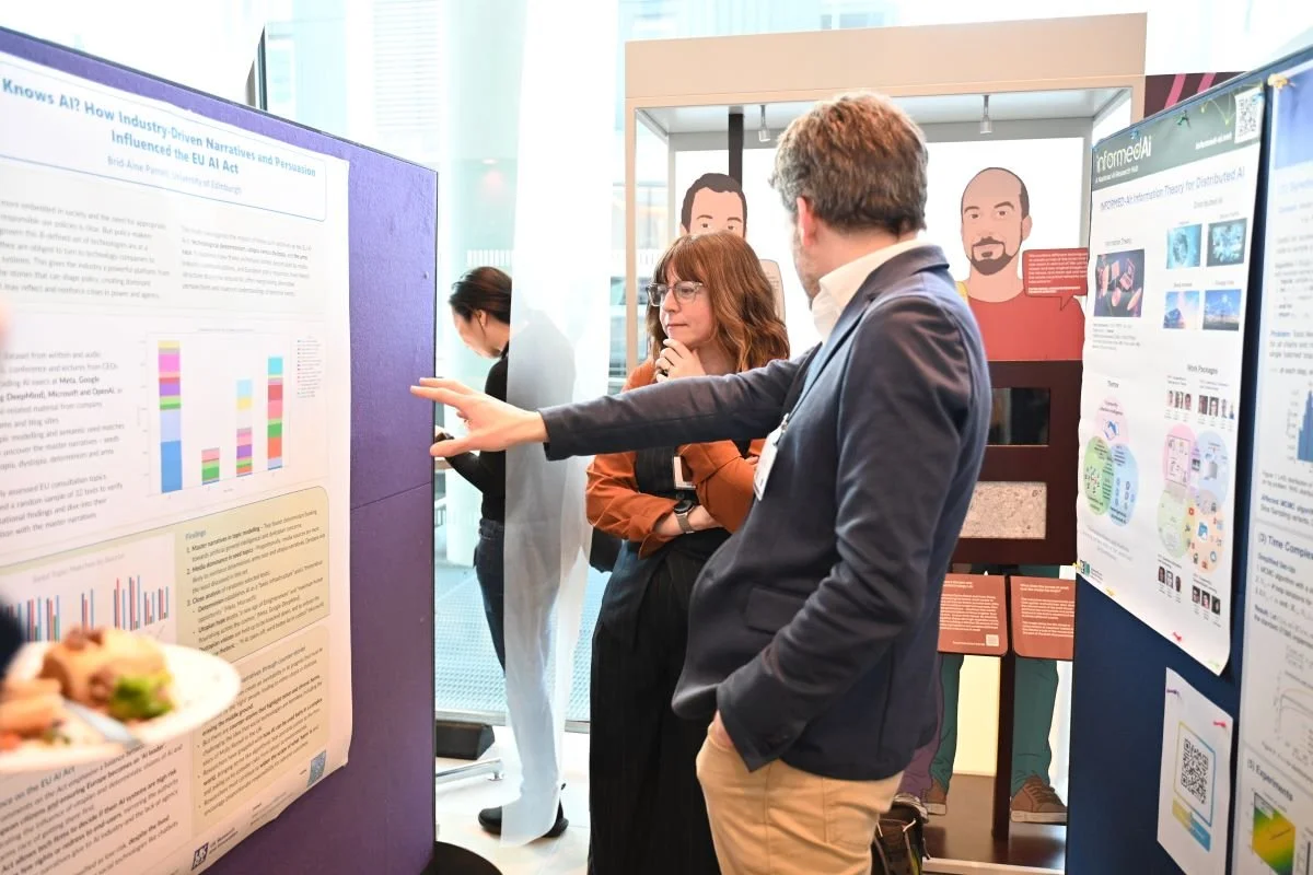  A poster exhibitor discussing their research with Hub Investigator, Professor Jack Stilgoe of UCL (credit: Michelle McGrath) 
