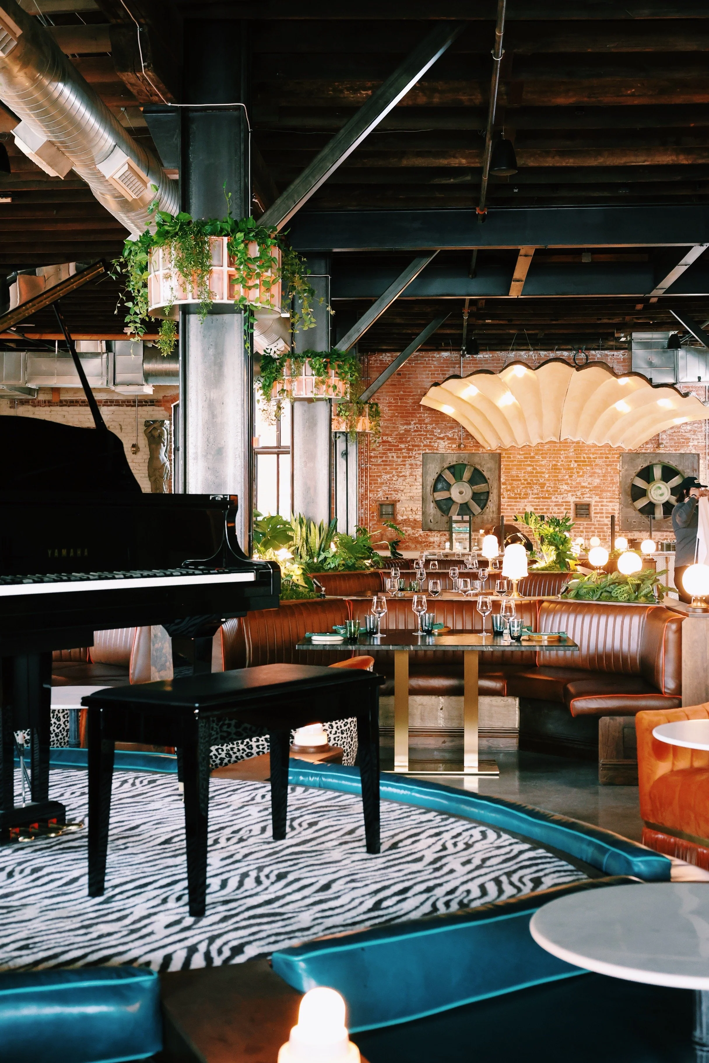 A view of the grand piano overlooking the raw bar in Red Herring's Cocktail Lounge