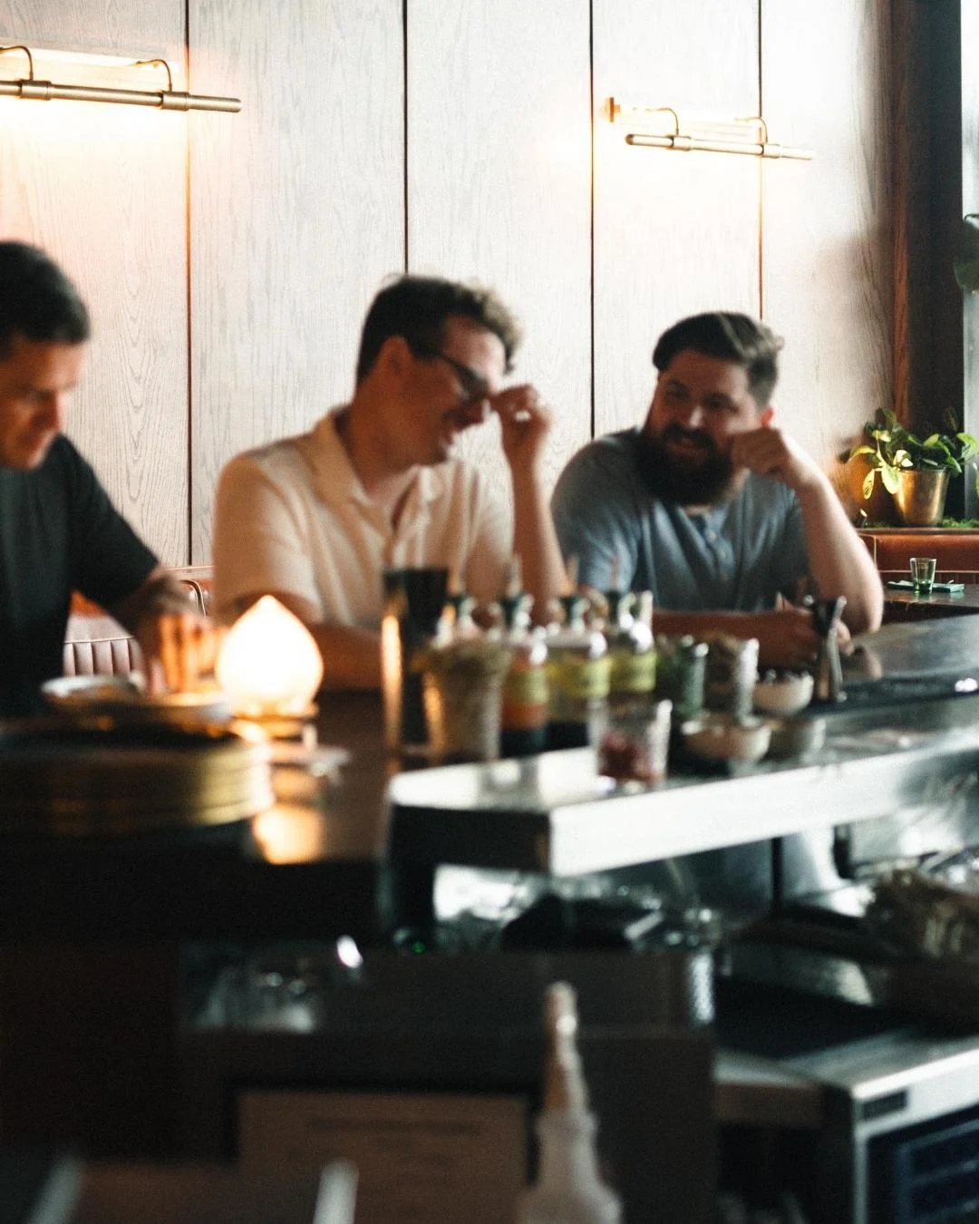 People sitting at the bar and enjoying a drink at Red Herring Restaurant and Cocktail Lounge