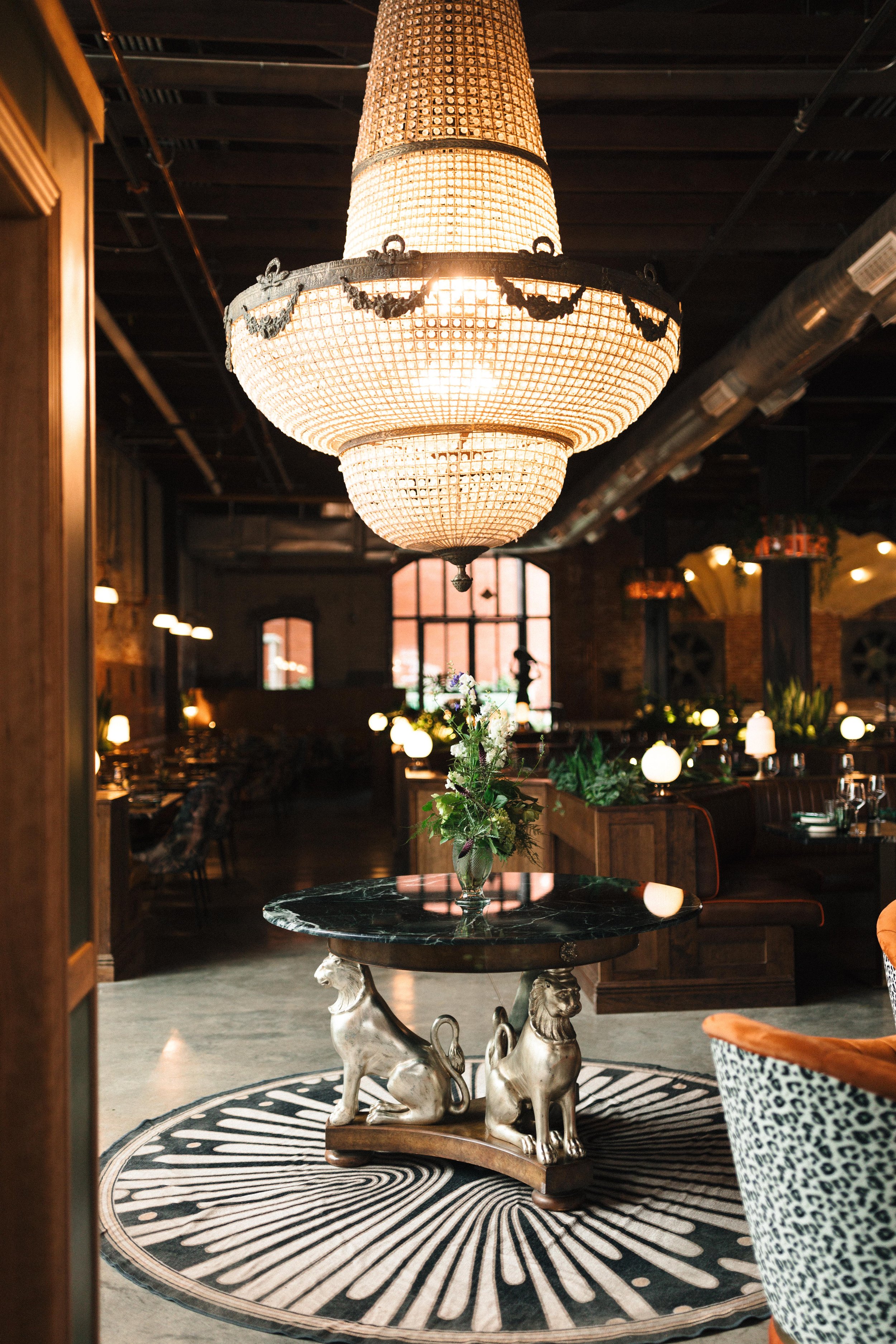 A view of the grand entrance at Red Herring Restaurant with a crystal chandelier 