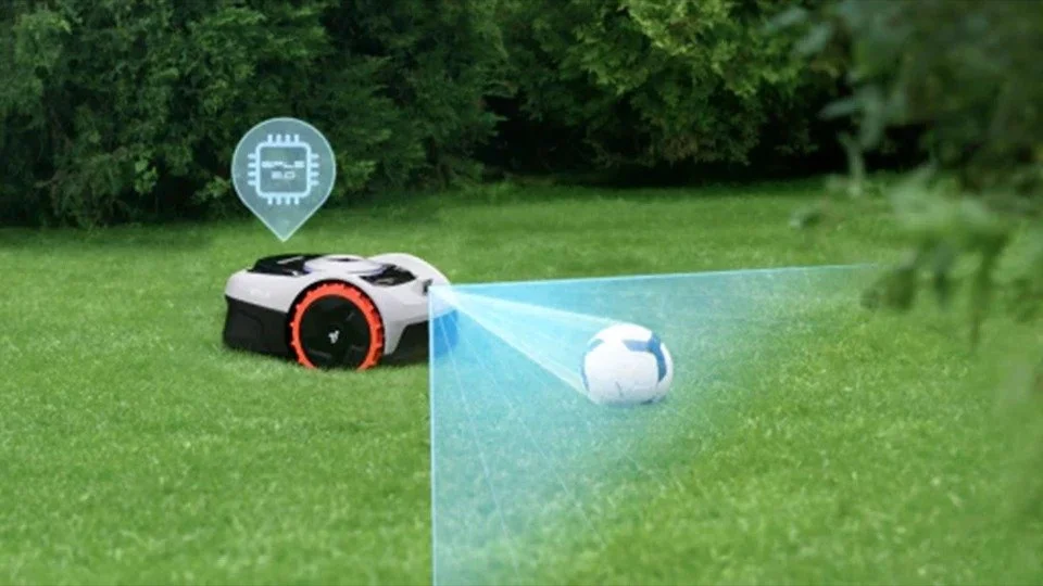 Lawn mower equipped with robotic technology, with a laser or sensor scanning a small robotic lawn mower on the grass.