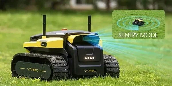 A yellow and black robotic lawn mower with wireless antennas and tracks, showing a small inset image of the mower in Sentry Mode, projecting a protective laser grid around itself.