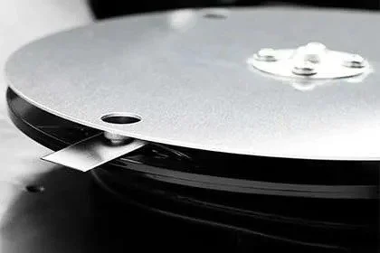 Close-up of a Husqvarna Automower Cutting Disk with sharp razor blades.