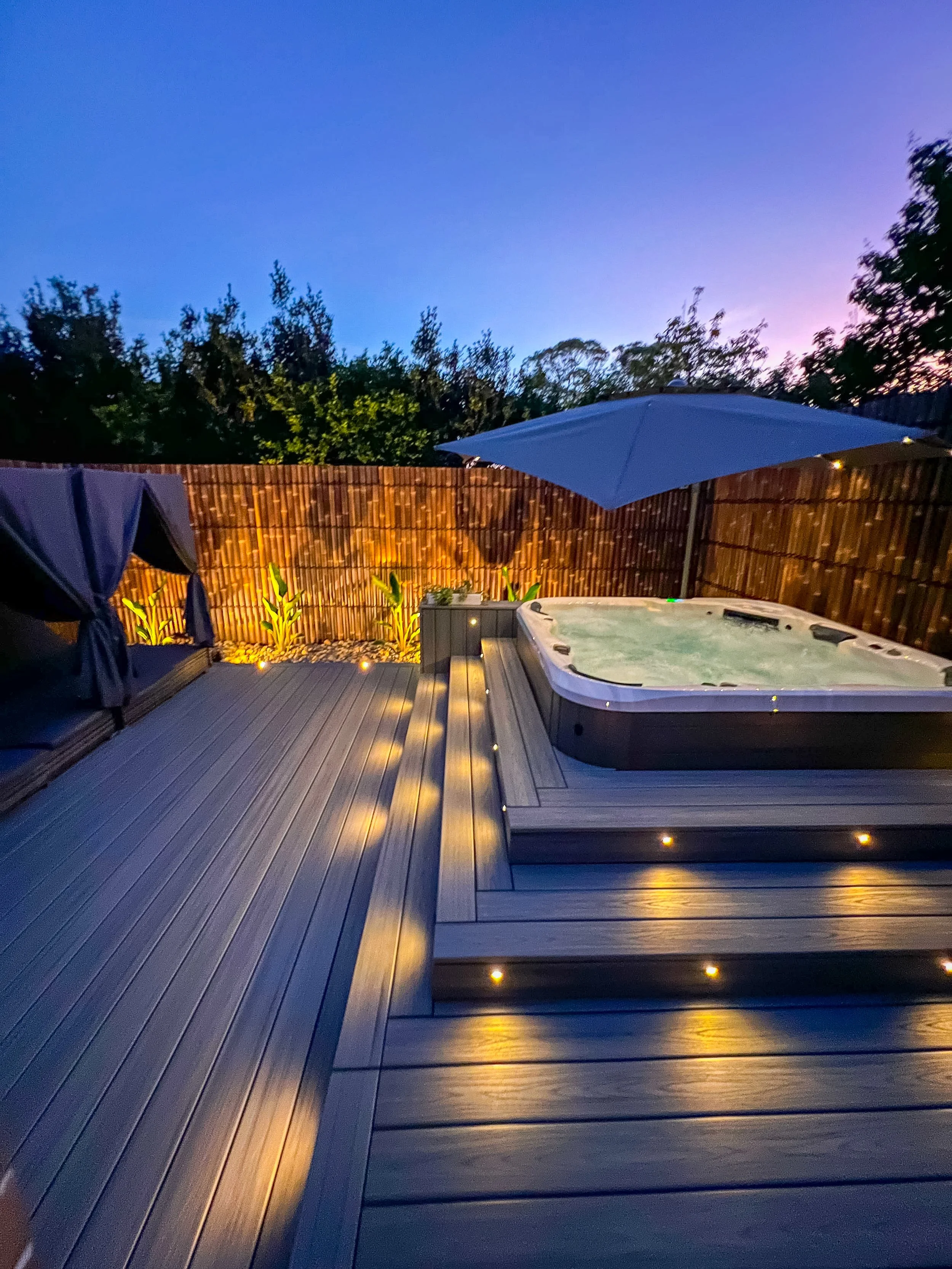 Trex Composite Decking in Island Mist installation with hot tub and decking lights