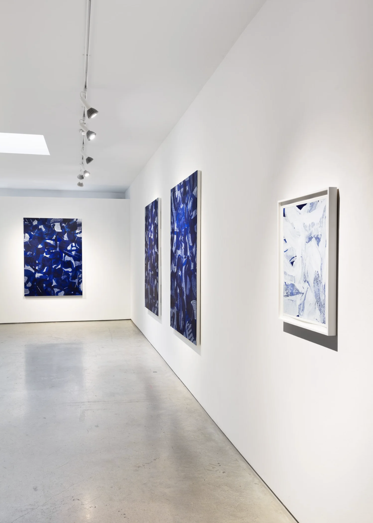 Art directed gallery installation photography featuring large-scale blue and white abstract paintings displayed in a white cube contemporary art space for General Hardware Contemporary.