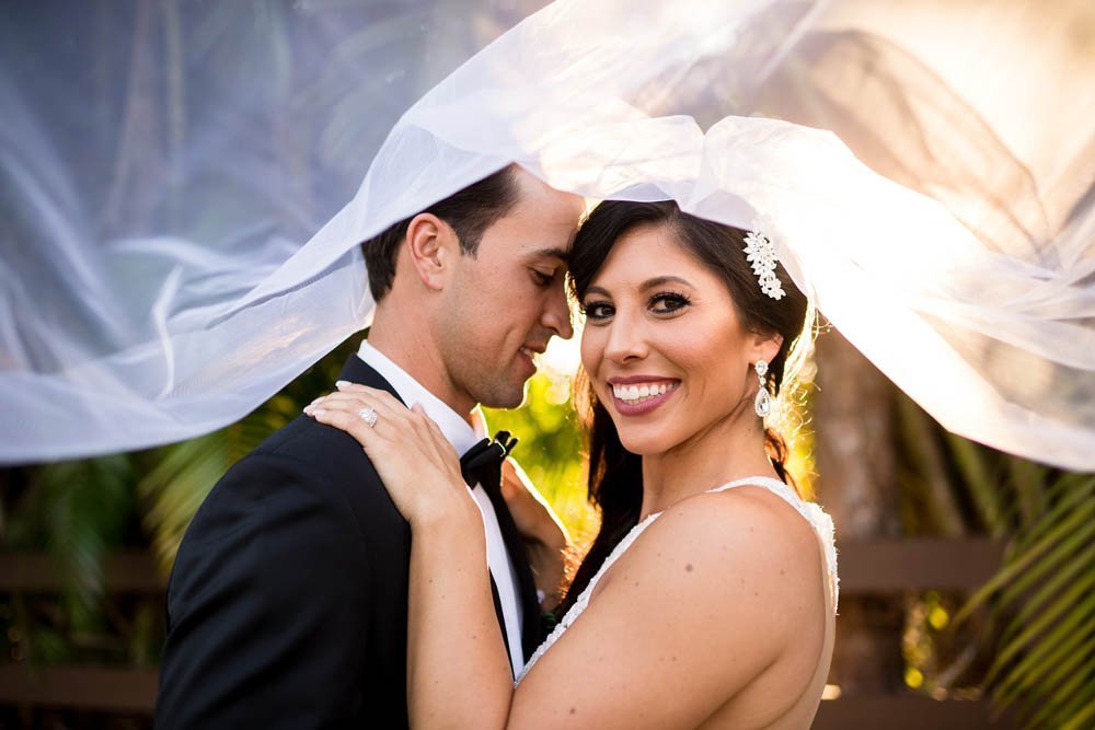 Bride and Groom Under Veil - Wedding Photographer Naples FL