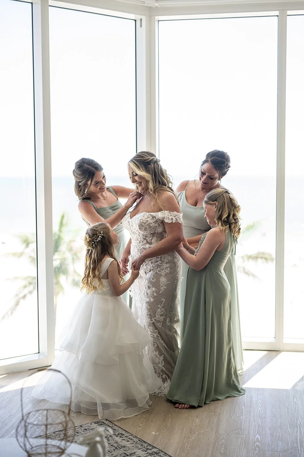 Bride and Bridesmaids getting dressed naples wedding photographer