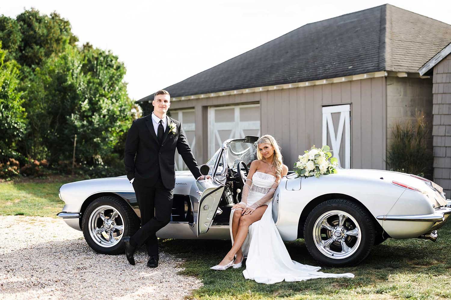 Bride and Groom with classic car in front of barn