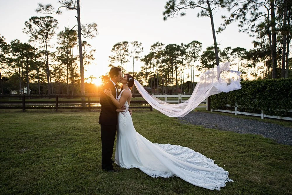 Bride and Groom Veil Blowing in the wind naples wedding photographer