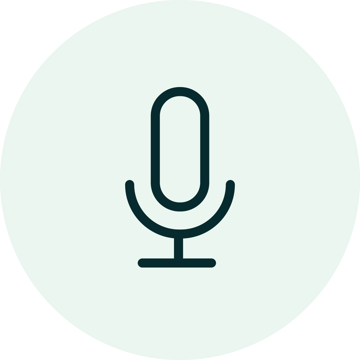 Icon of a microphone within a circular background.