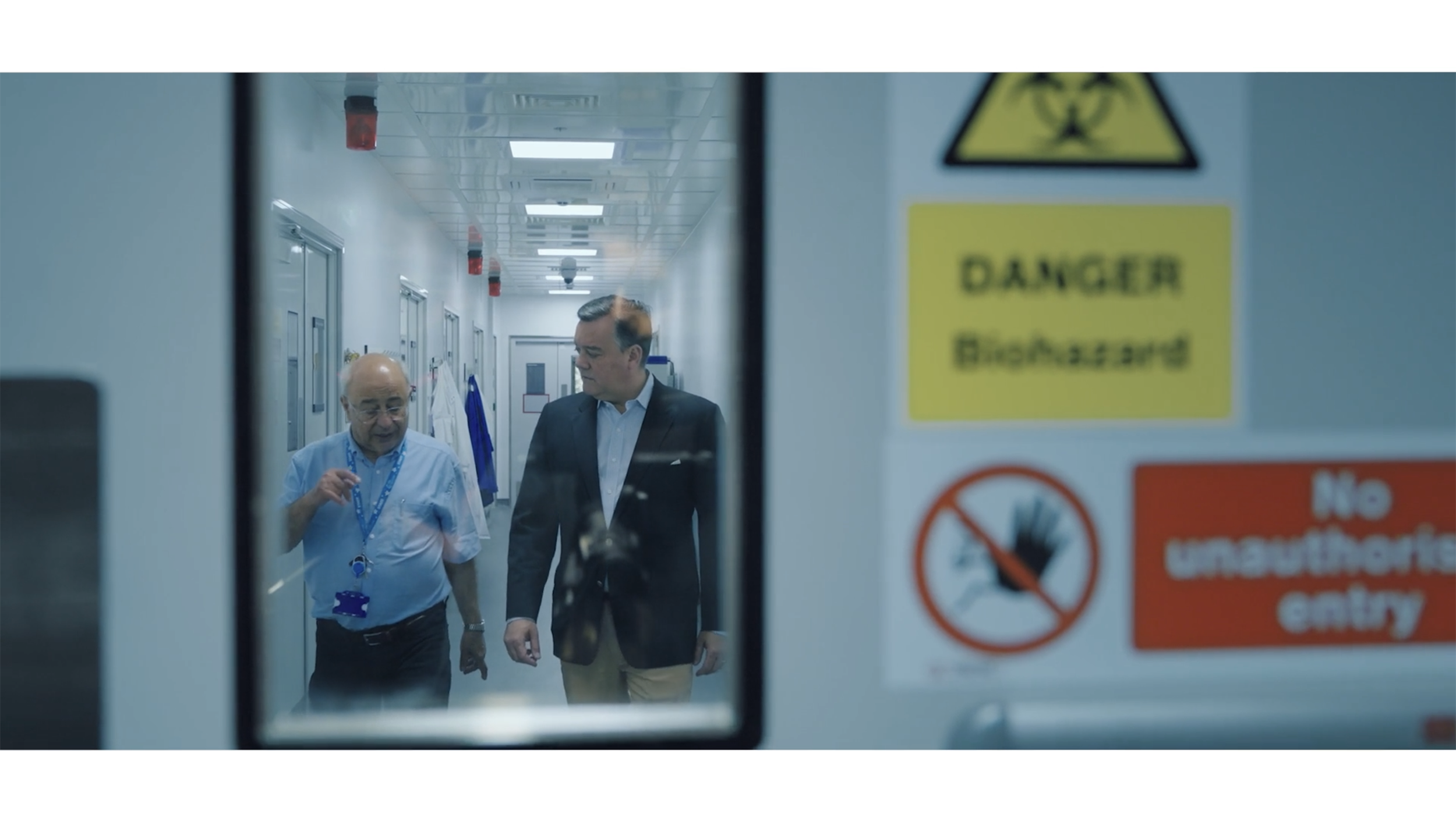 Video Screen Shot_John_Farzin in hallway 2500x1406.png