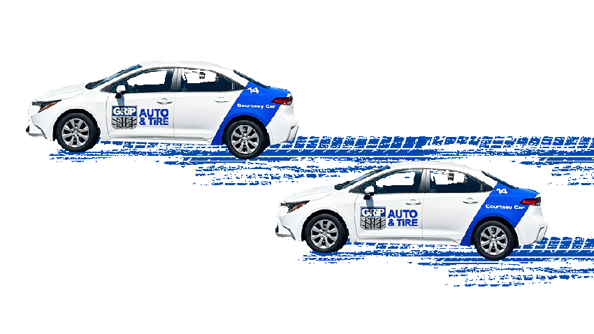 Two white courtesy cars from Grip Auto & Tire driving with stylized blue tire tracks visible.