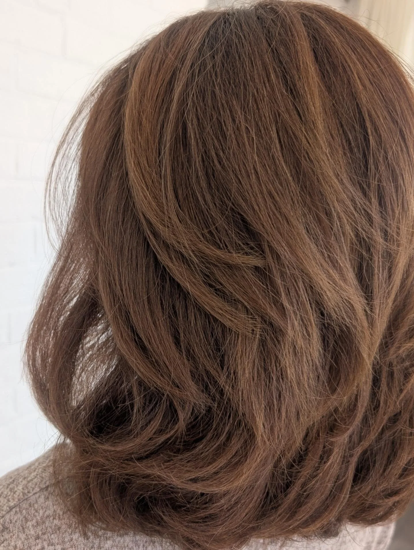 controlled warmth instead of brass: The before and after that left us with a stunning 5 star review. 
We absolutely loved having this beauty in, and taking her from hair that didn't feel like her to something softer, beautiful and more HER.
It was sm