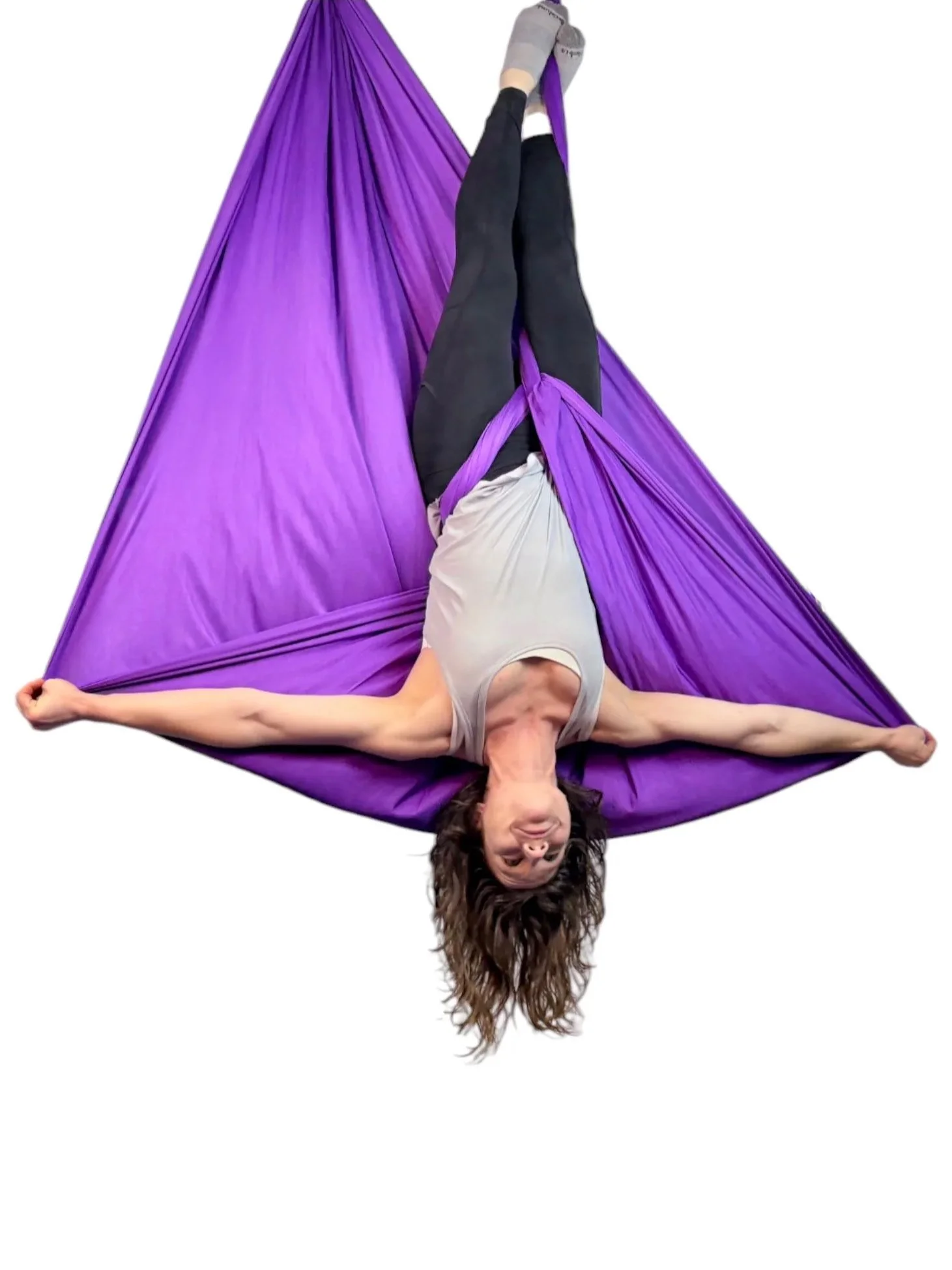 Woman building strength in aerial sling with activation method