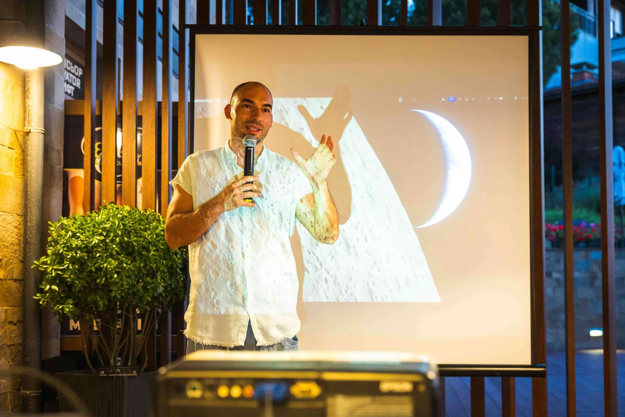 Speaker addressing guests at an evening event in Sozopol