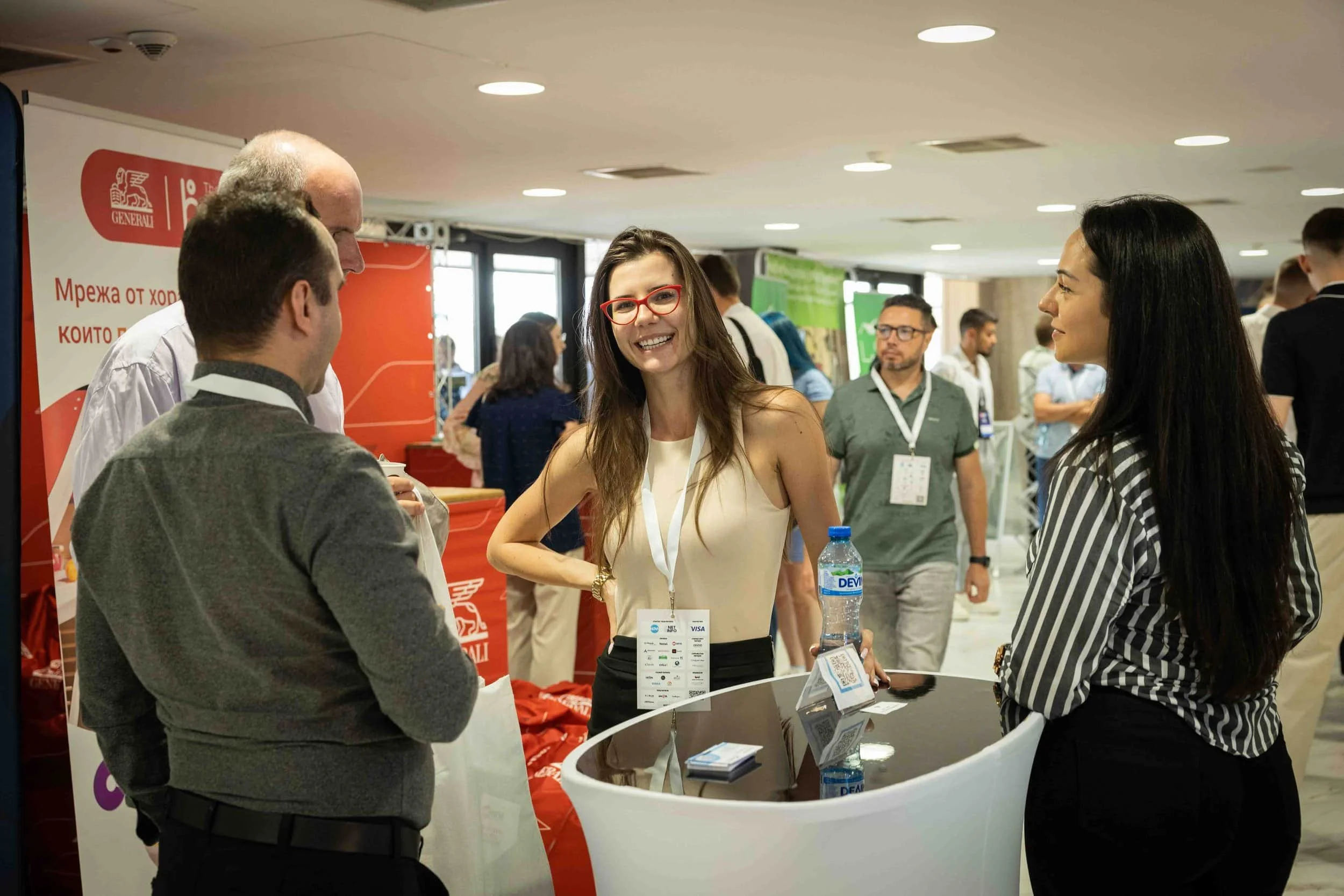 Interaction between an exhibitor and visitors at Webit 2025 in Sofia