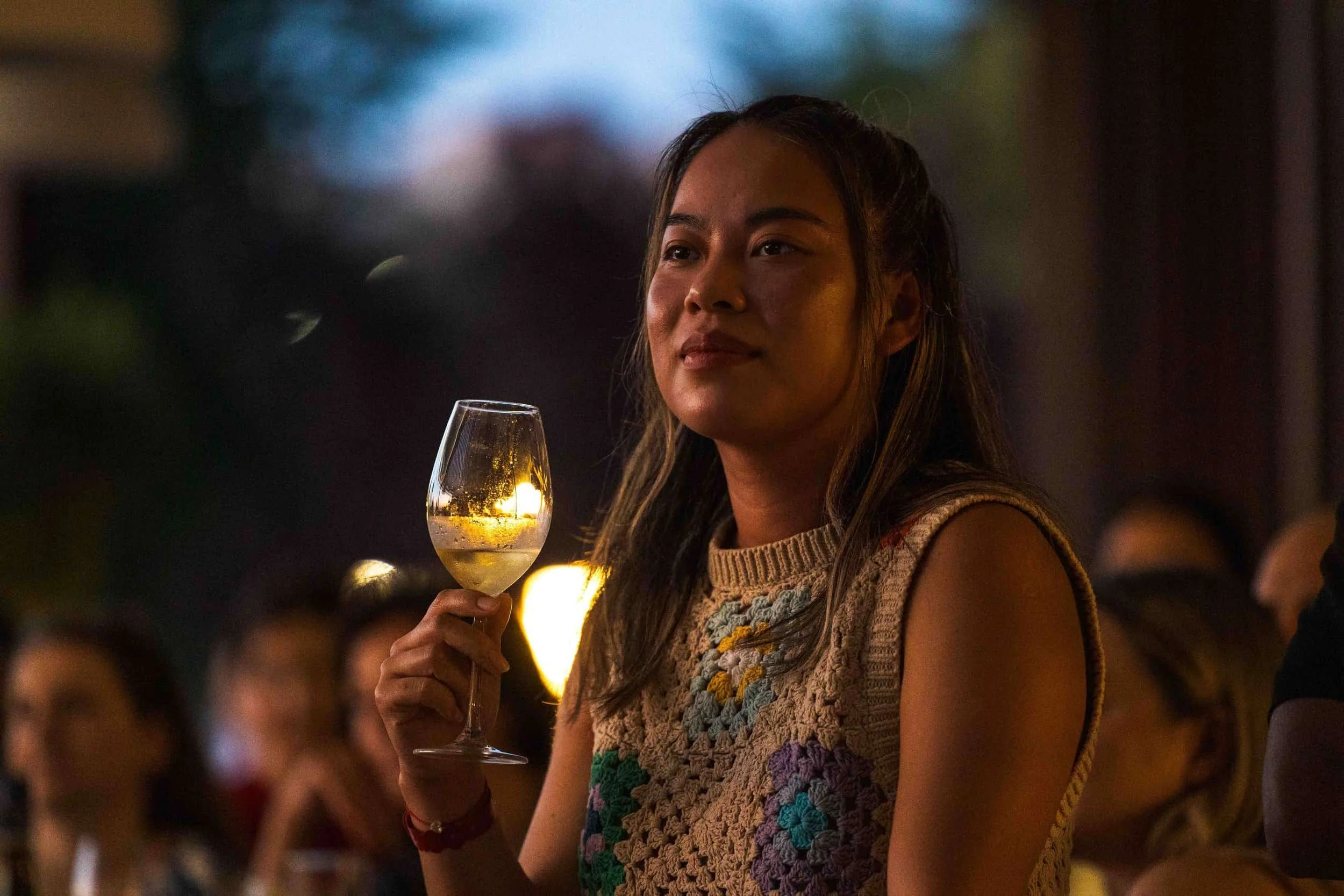 Guest holding a glass during an evening reception in Sozopol