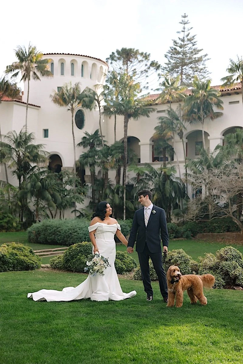 Elopement couple with dog in front of the rotunda at the Santa Barbara Courthouse