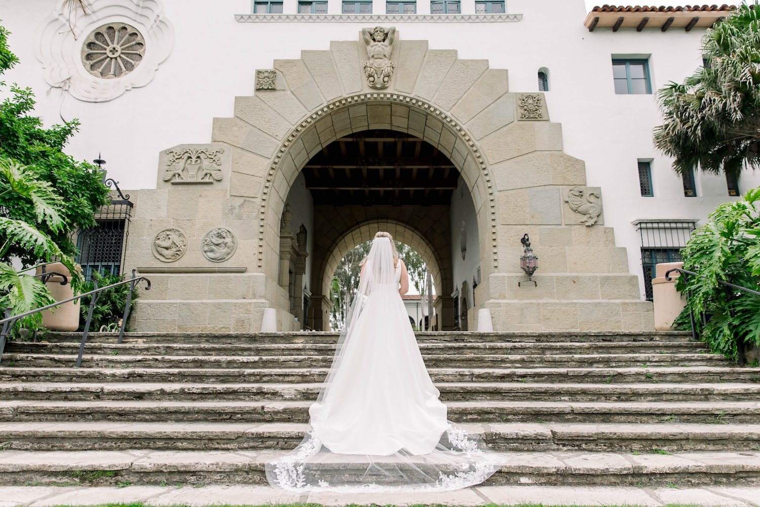 Bride ready for elopement in front of the main arch at the Santa Barbara Courthouse