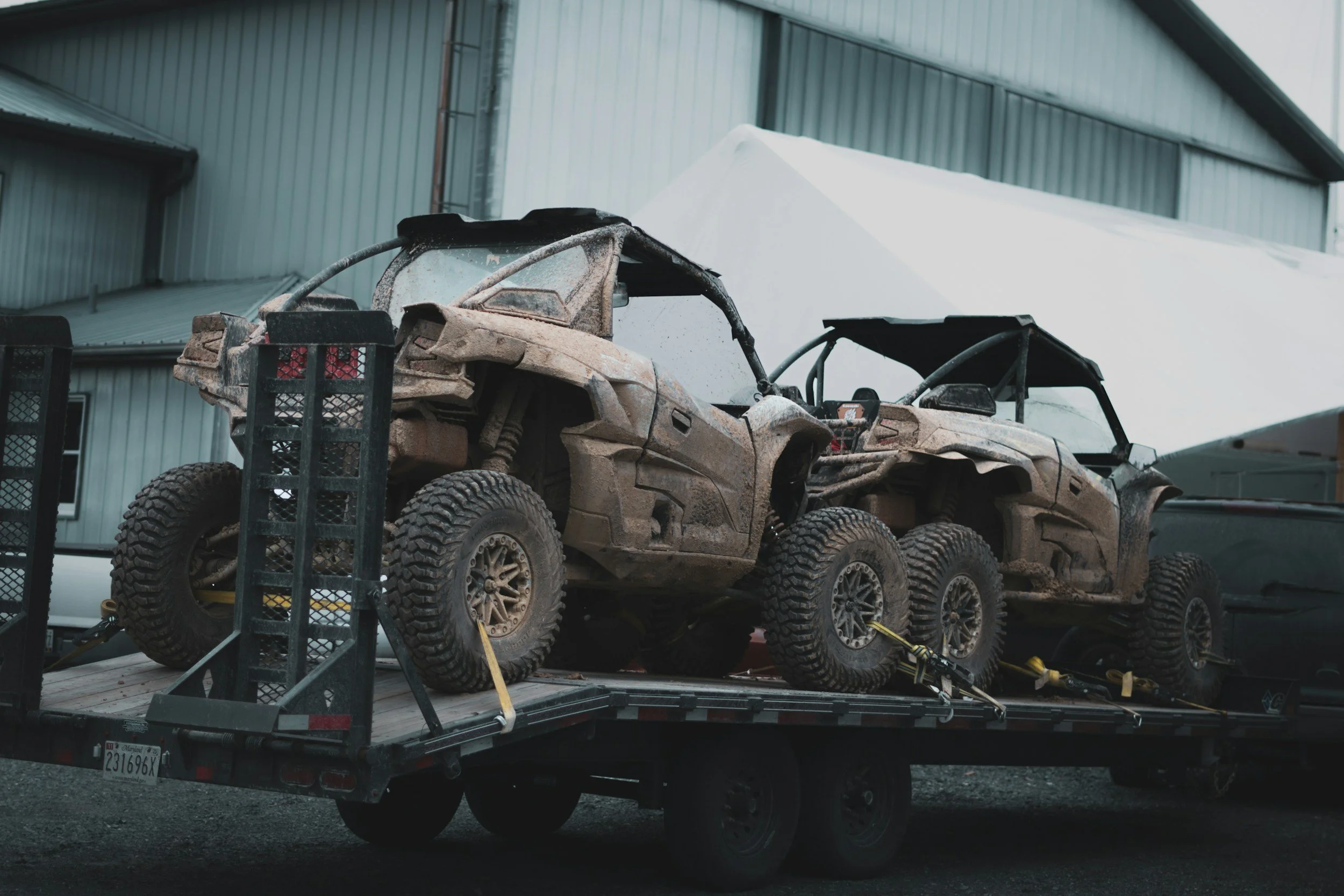 Stock photo of a utility equipment trailer carrying off-road vehicles