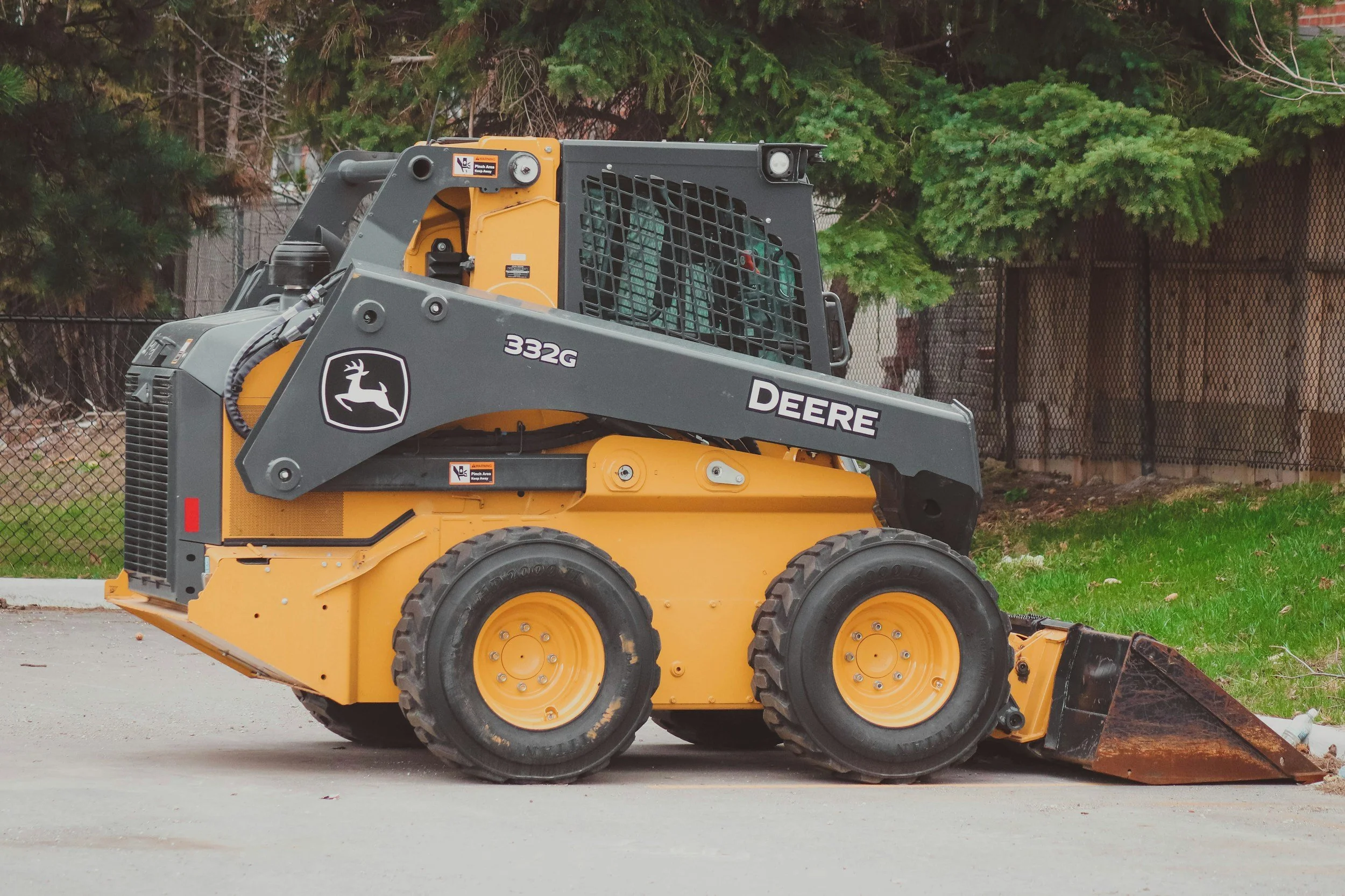 Stock photo of a wheeled skid steer with a bucket