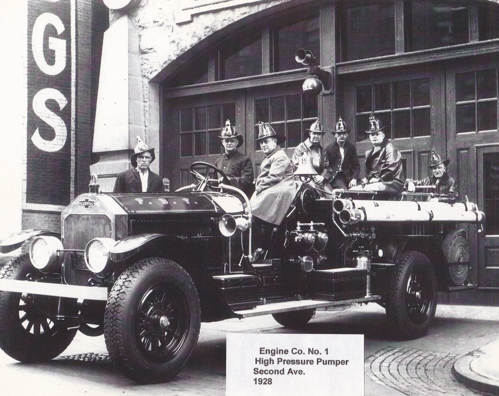 Vintage photograph of Pittsburgh Engine Company No. 1 firefighters and a fire engine outside their firehouse