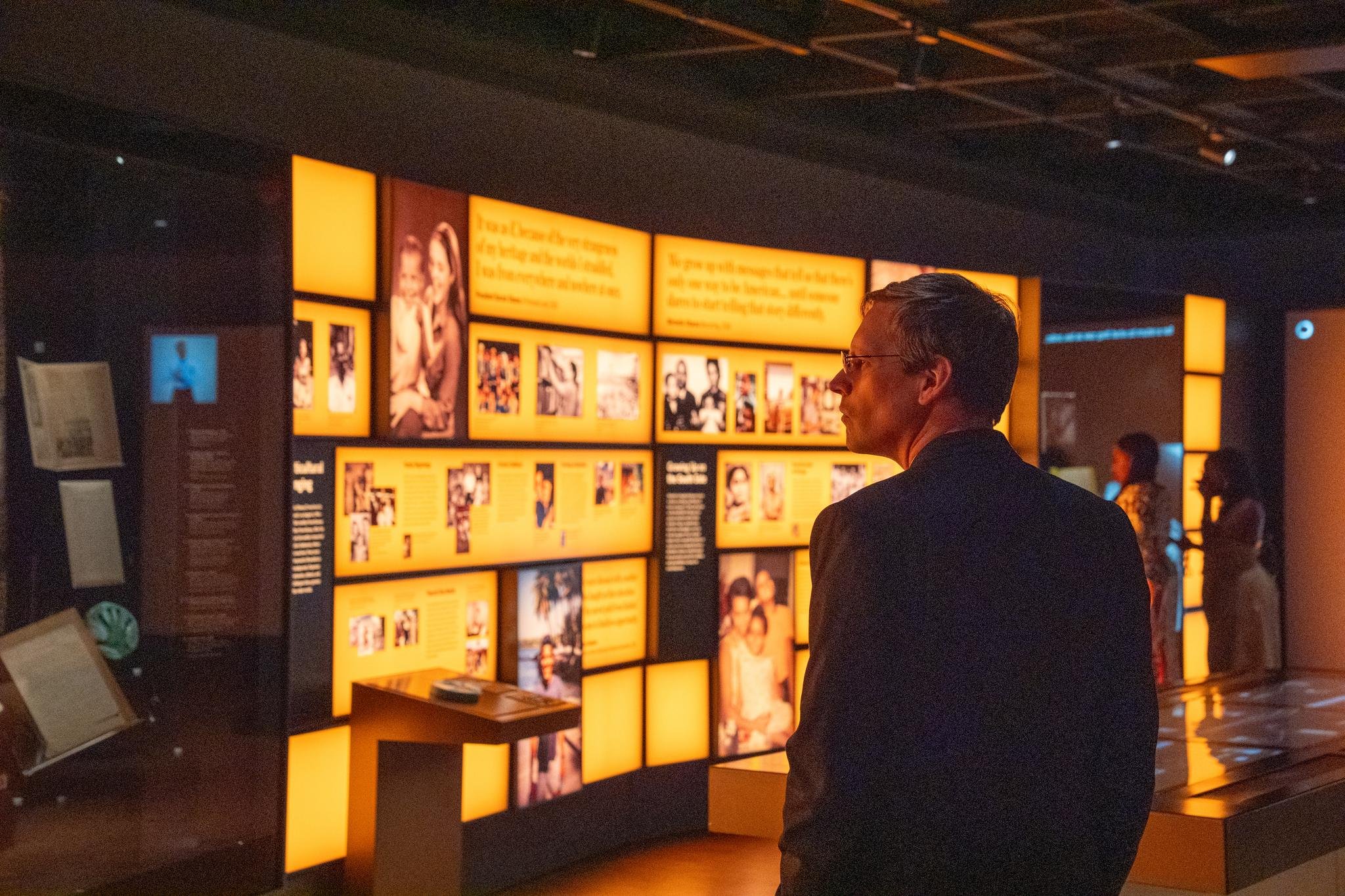 An event guest takes time to explore the exhibits at the Obama Presidential Center Museum