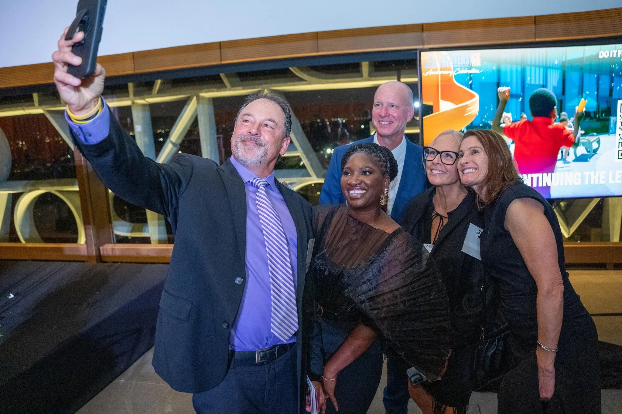 Event guests taking a selfie of themselves