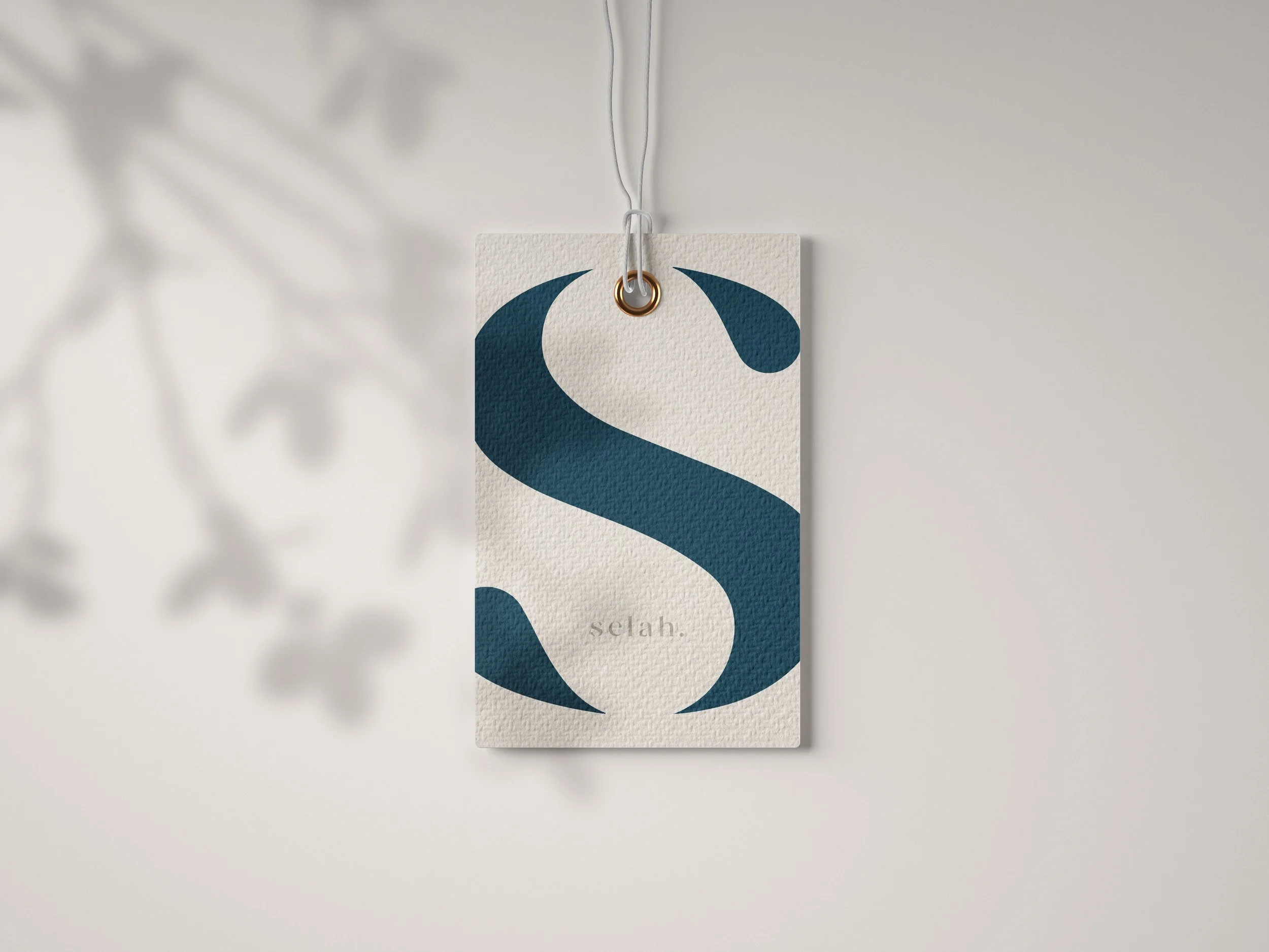 Selah Spa branded bag tag with luxury spa identity