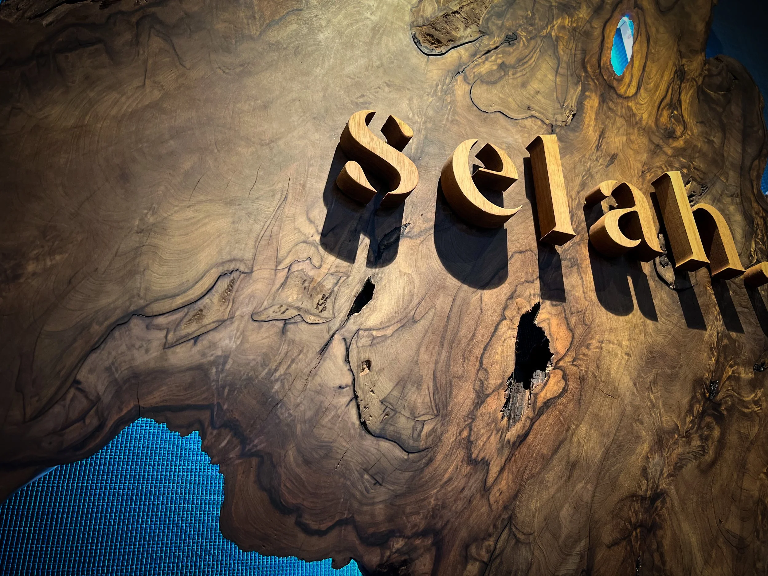 Selah Spa back-lit cypress entrance sign carbon-dated to 182 B.C.