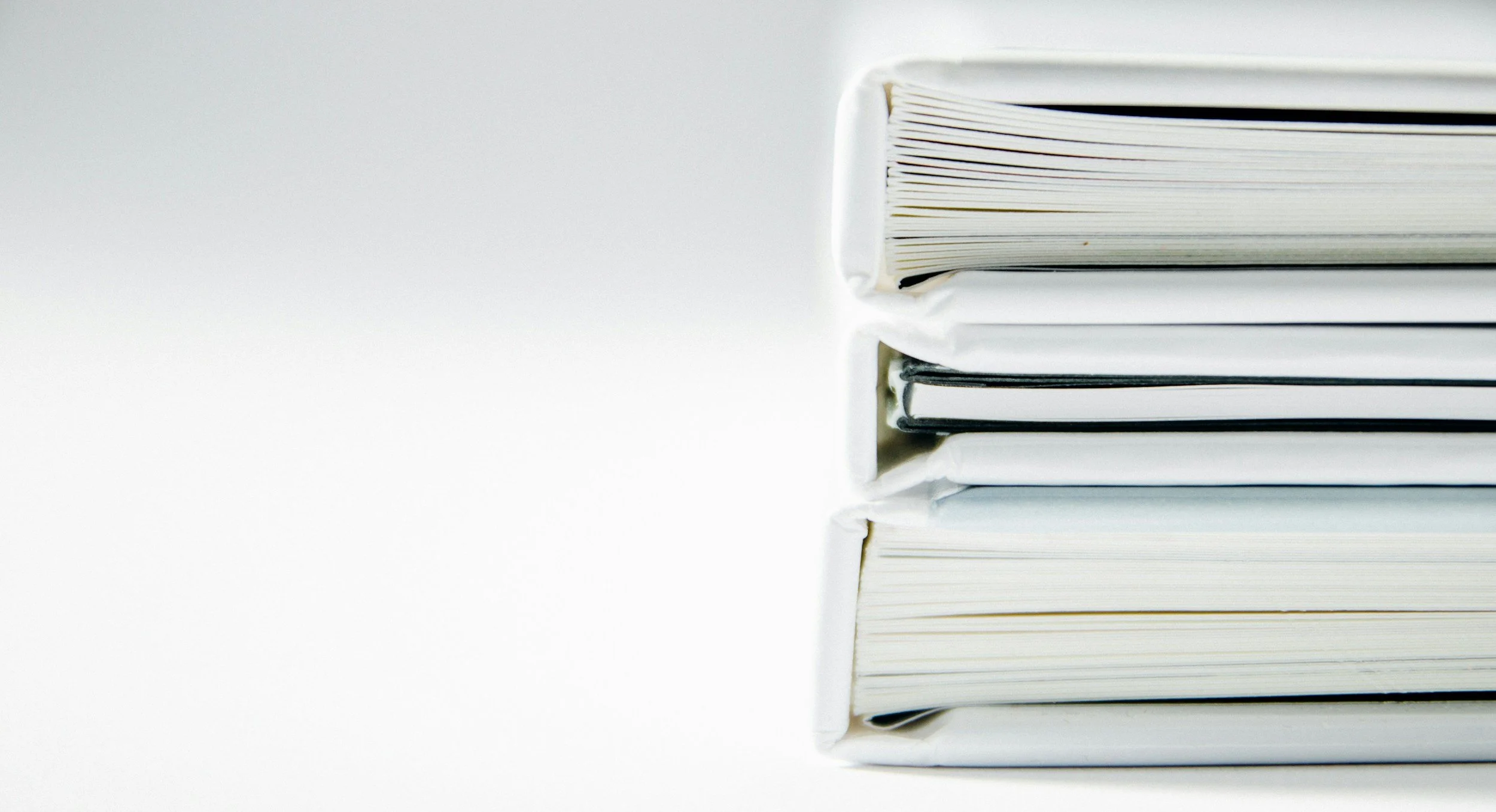 Stack of white books or magazines on a white background