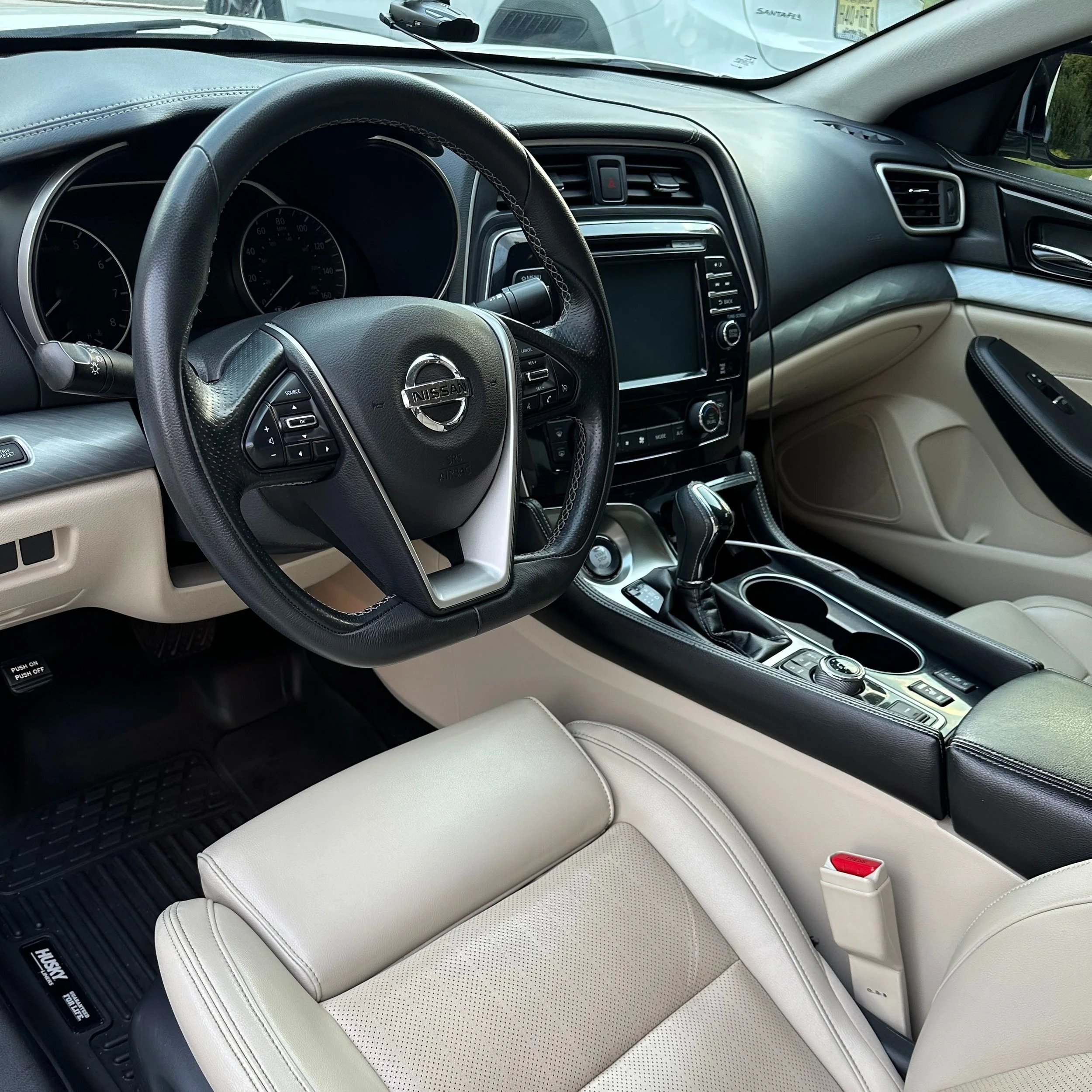 Interior detailing on a luxury vehicle showcasing leather cleaning, carpet extraction, and interior surface protection in Monmouth County, NJ.