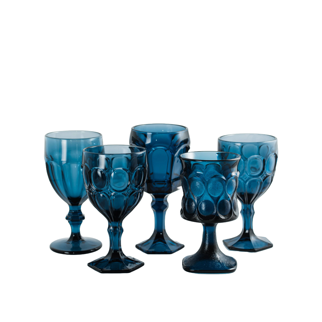 Set of five blue glass goblets with textured and smooth surfaces, displayed against a white background.