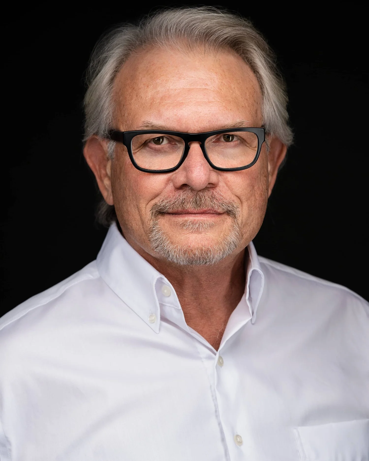 Professional headshot of a man in a suit — example of a corporate headshot by Simon Rochfort Photography Vancouver