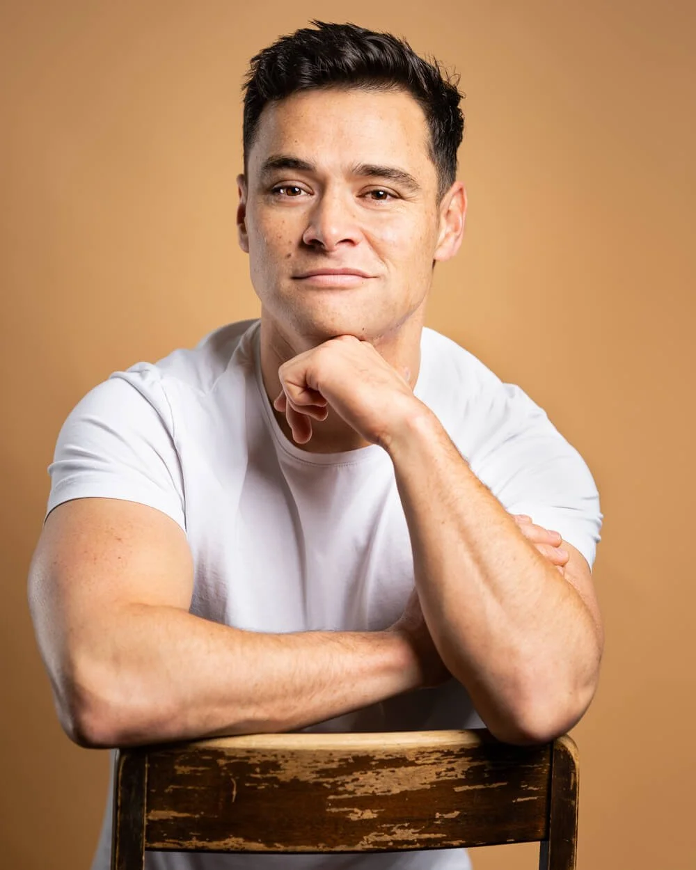 Actor headshot of a man sitting in Vancouver studio