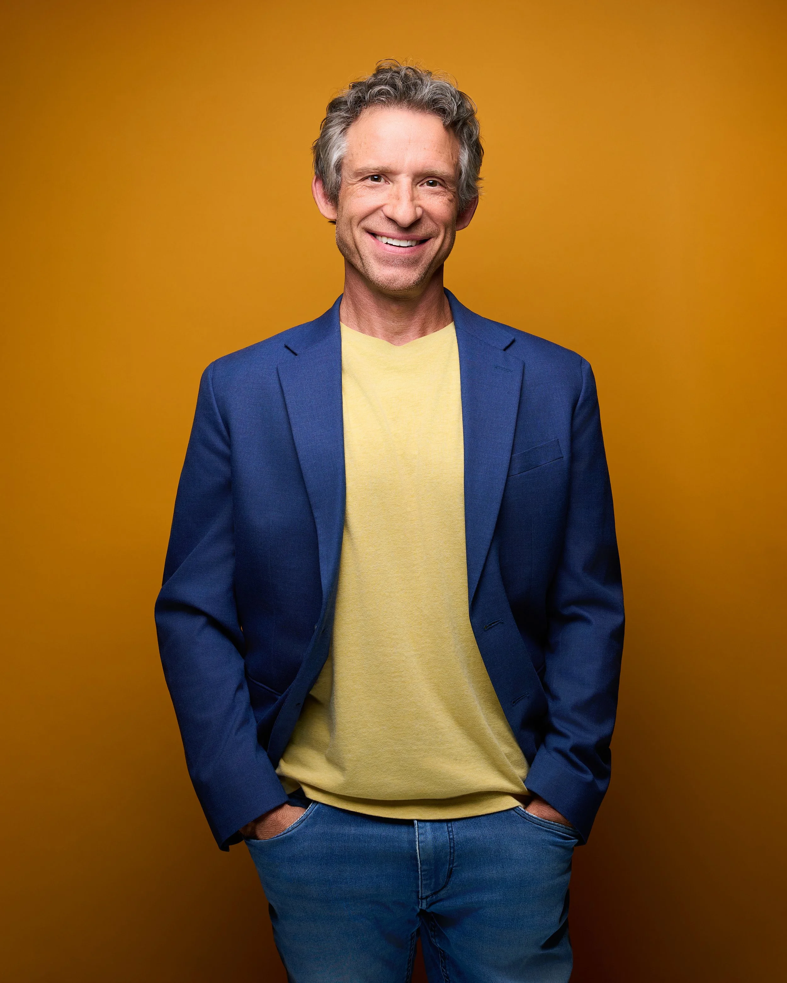 Corporate Headshot of Man on Yellow Background