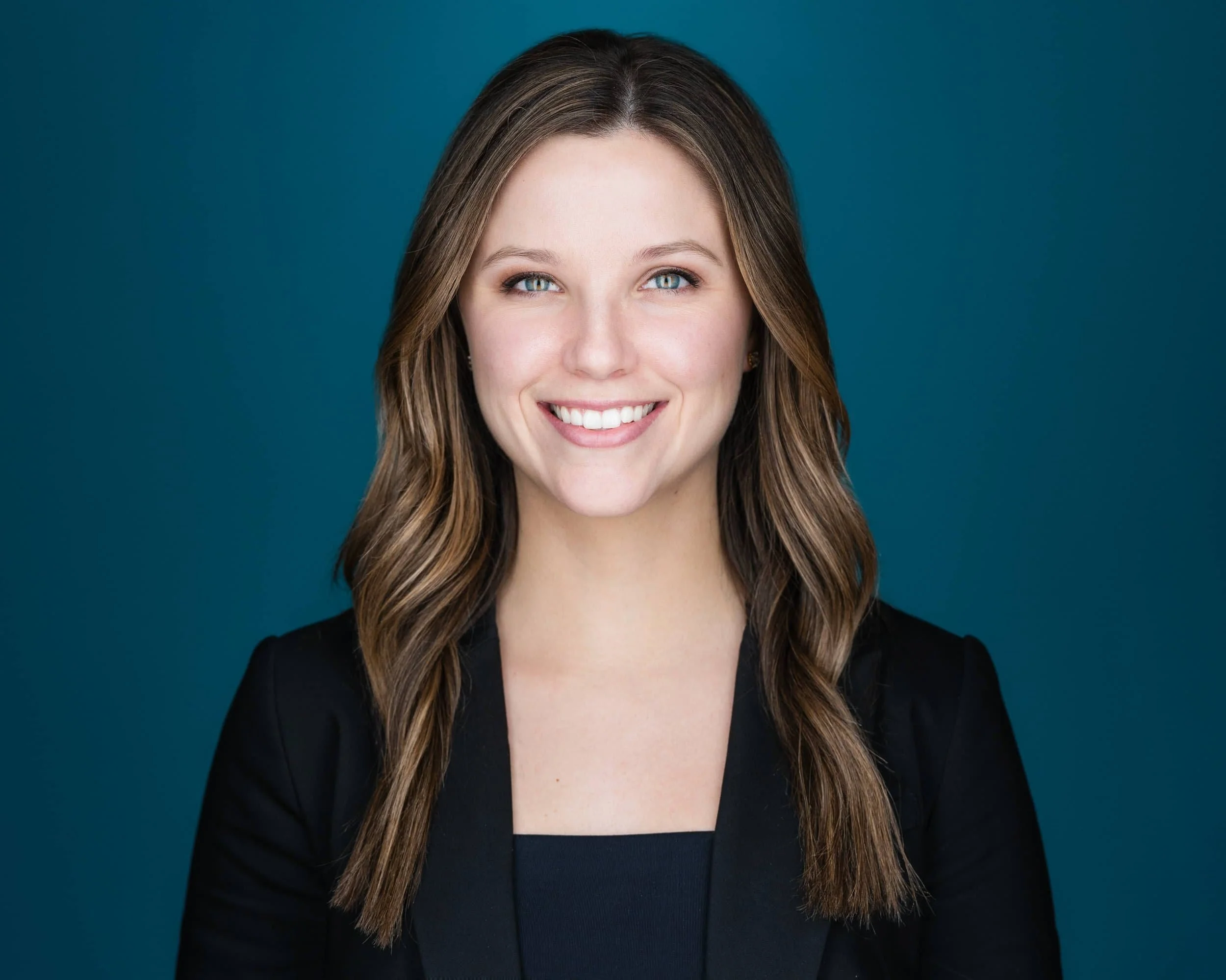 Headshot Vancouver of Woman with Blue Background