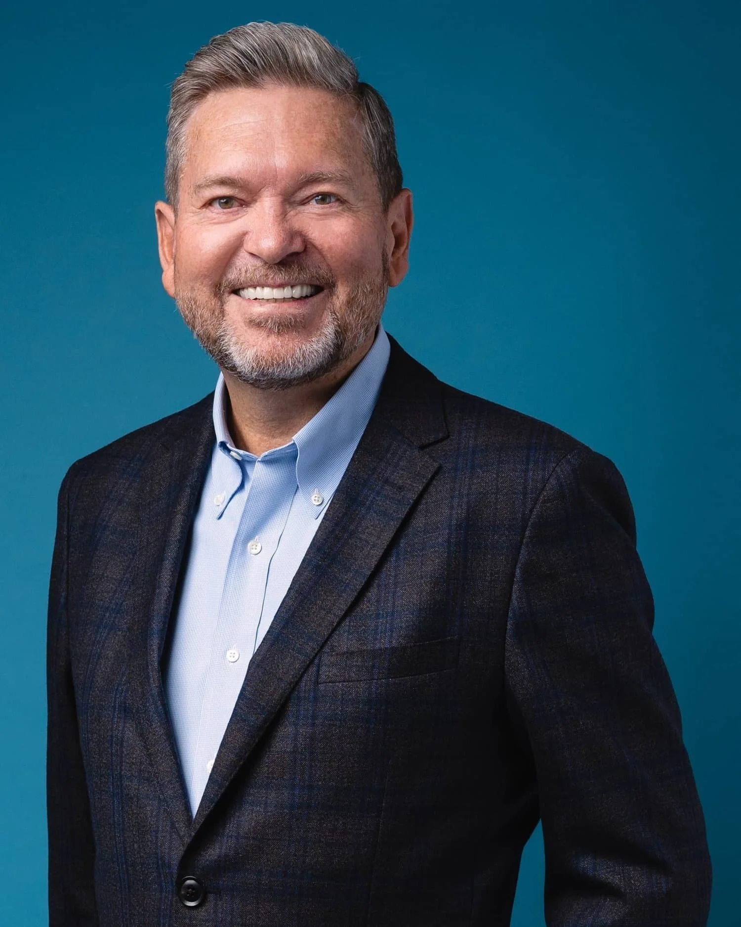 Headshots Vancouver of Man with Blue Background