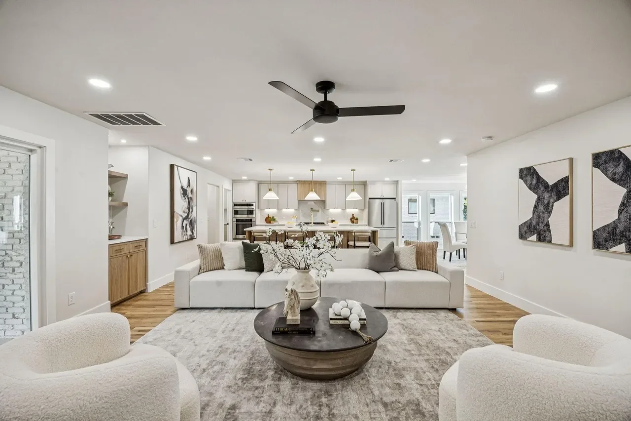 view from fireplace looking at living room and kitchen 