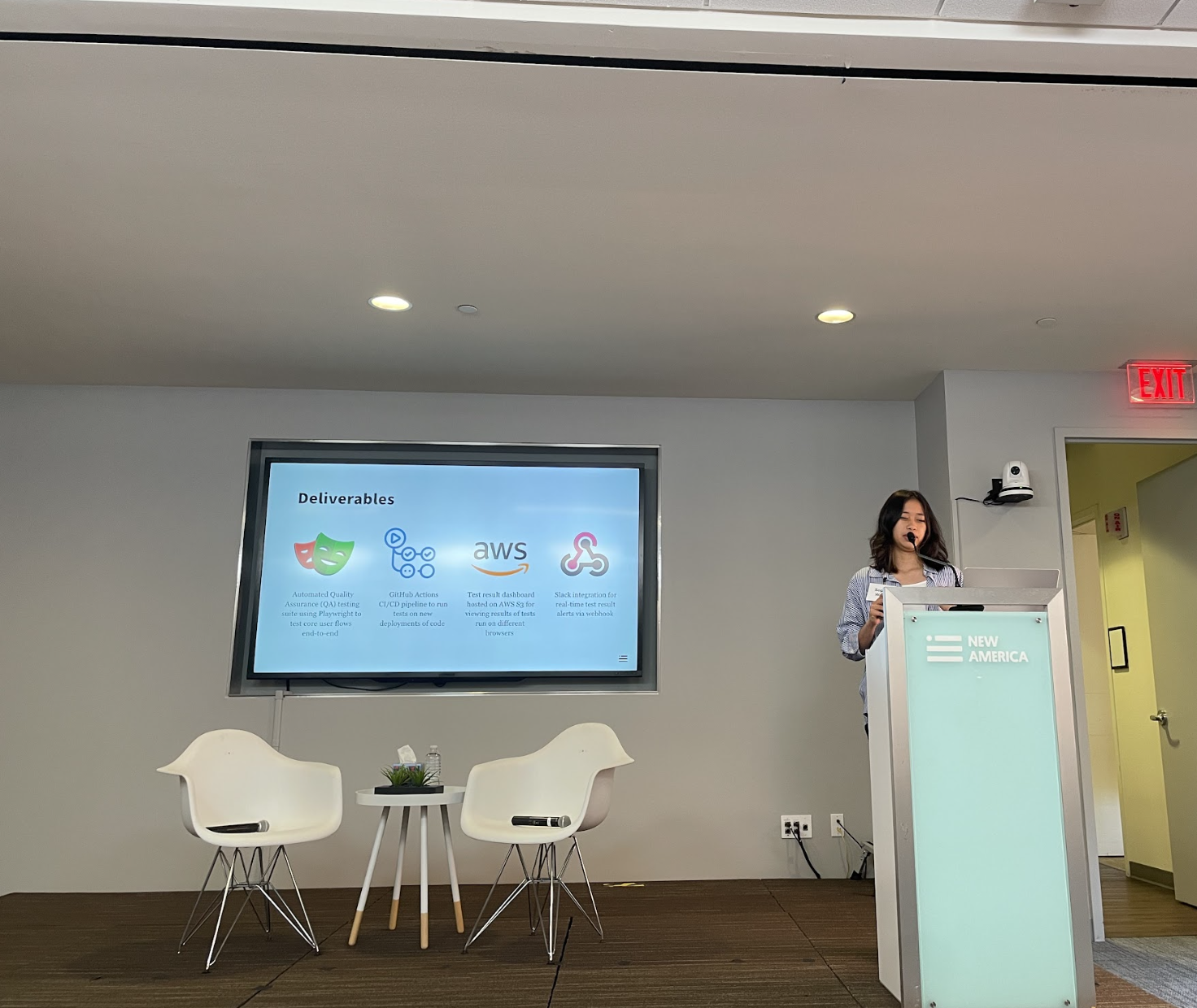 Person presenting on stage at podium