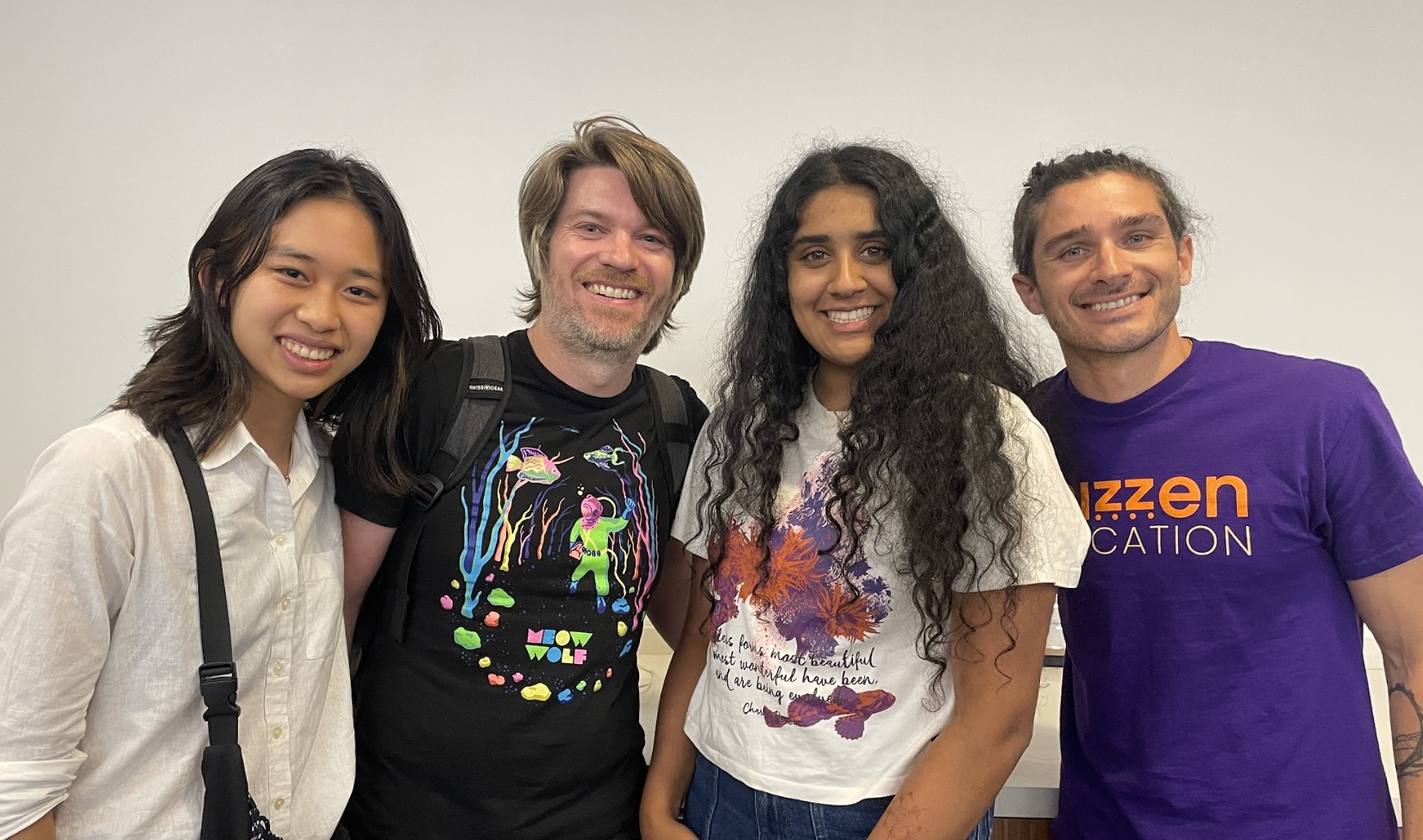 Four people smiling for a photo