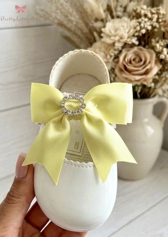Soft Sole White Shoe With Lemon Diamante Bow