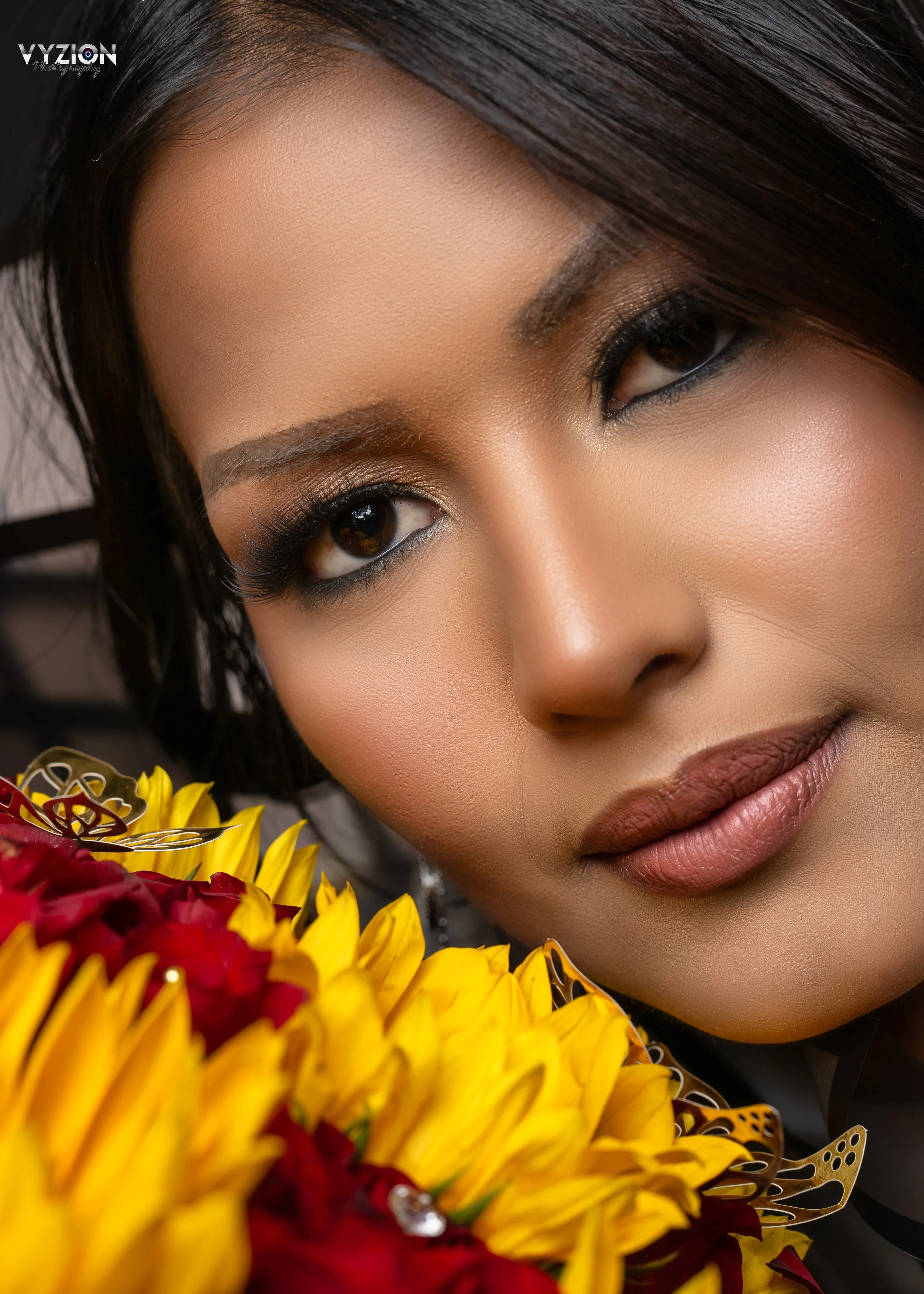 Close-up portrait of a woman with yellow and red flowers - personal branding photography in Columbia, SC by Vyzion