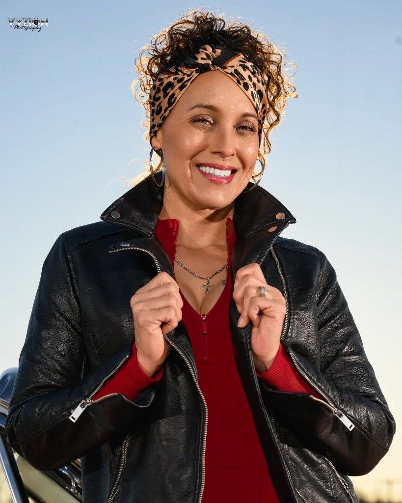 Profile Photo of Stephanie, a Columbia-SC-Photographer with Vyzion Photography, in a leather jacket with the sky in the background