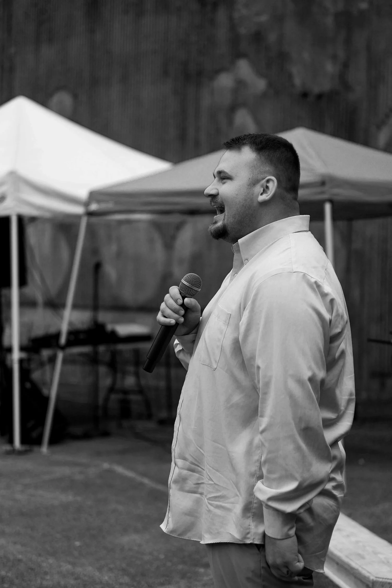 Kamron Engler speaking with a microphone