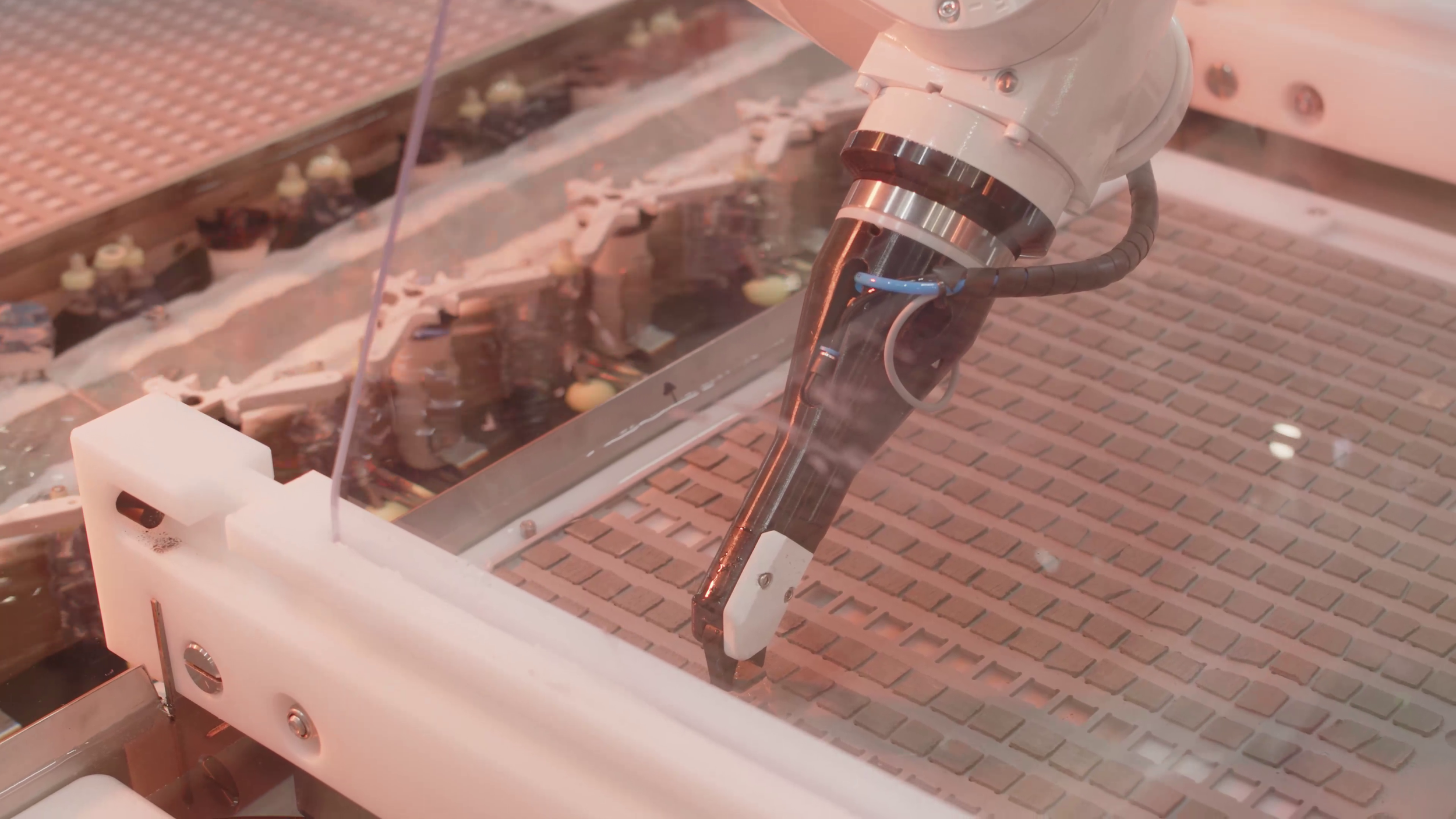 Thumbnail from the Great Barrier Reef Foundation video showing automated precision manufacturing using robotic technology.
