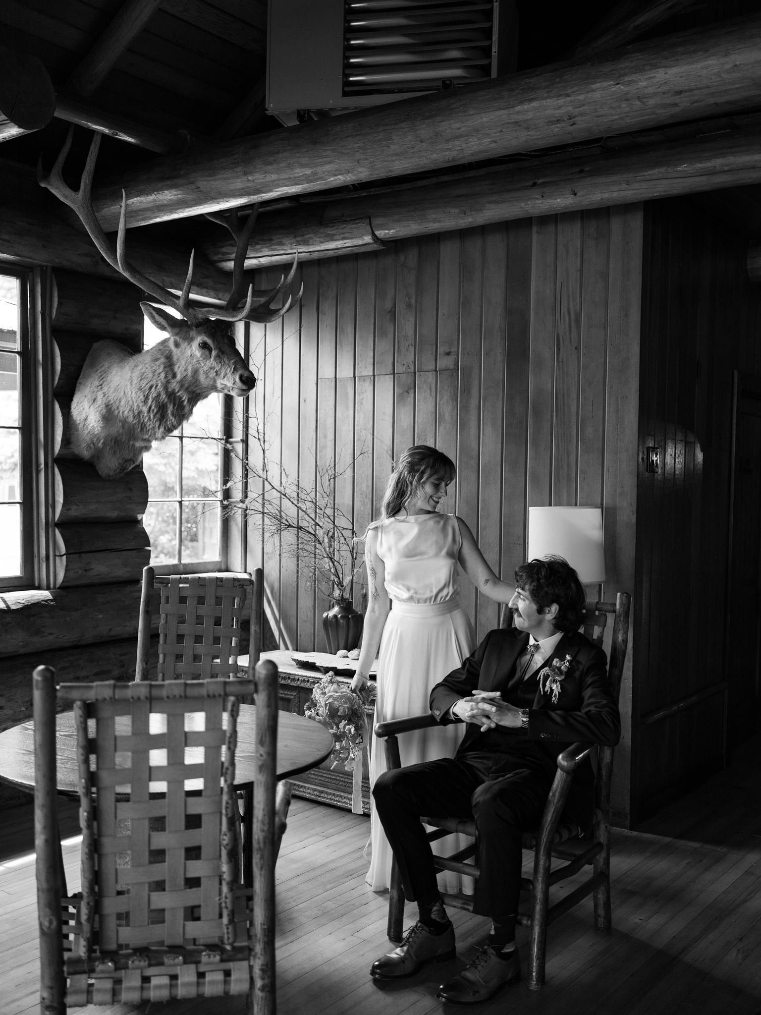 Black and white wedding portrait of Tamar and Hank inside Kiana Lodge in Poulsbo, Washington.